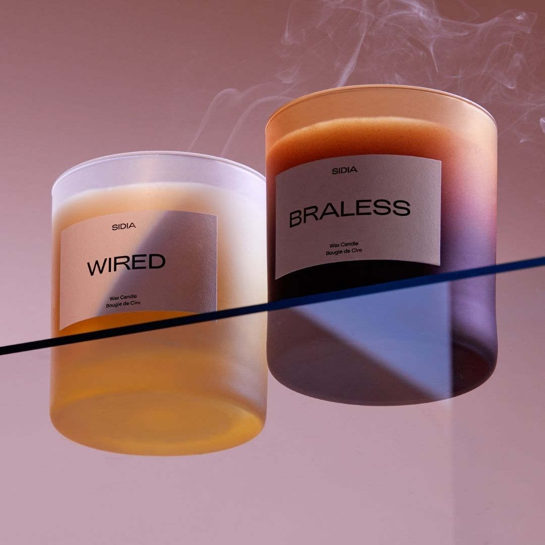 Wired & Braless candles together, purple background