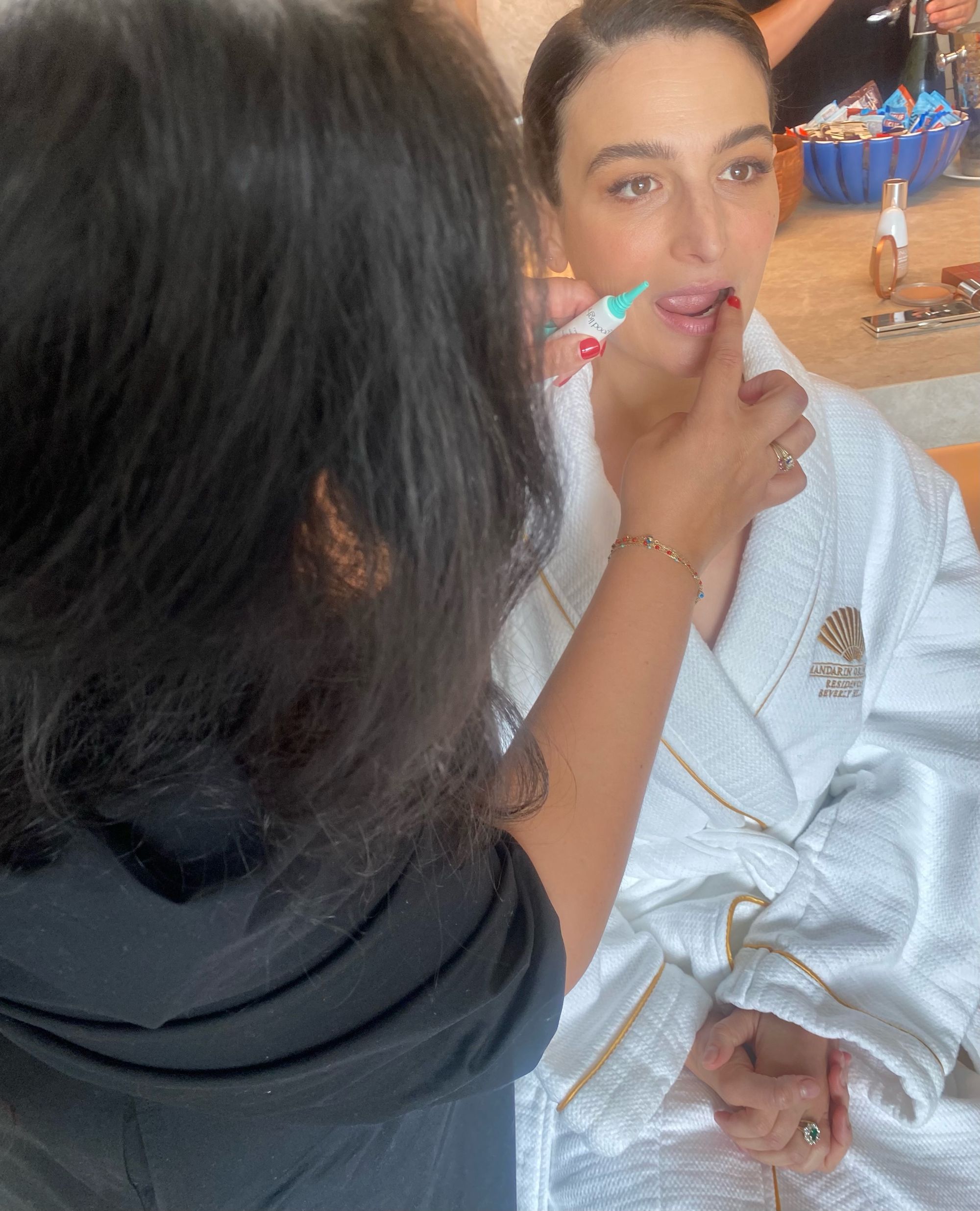 Makeup artist Kirin Bhatty uses good light's New Moon Balm on Jenny Slate as a lip prep!
