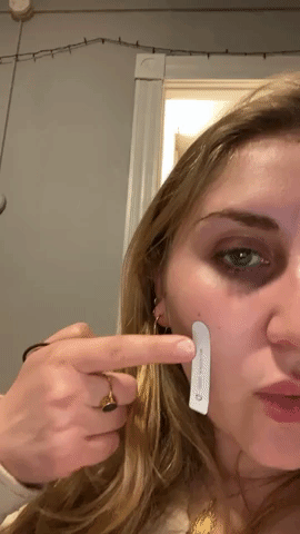 gif of test strip on face