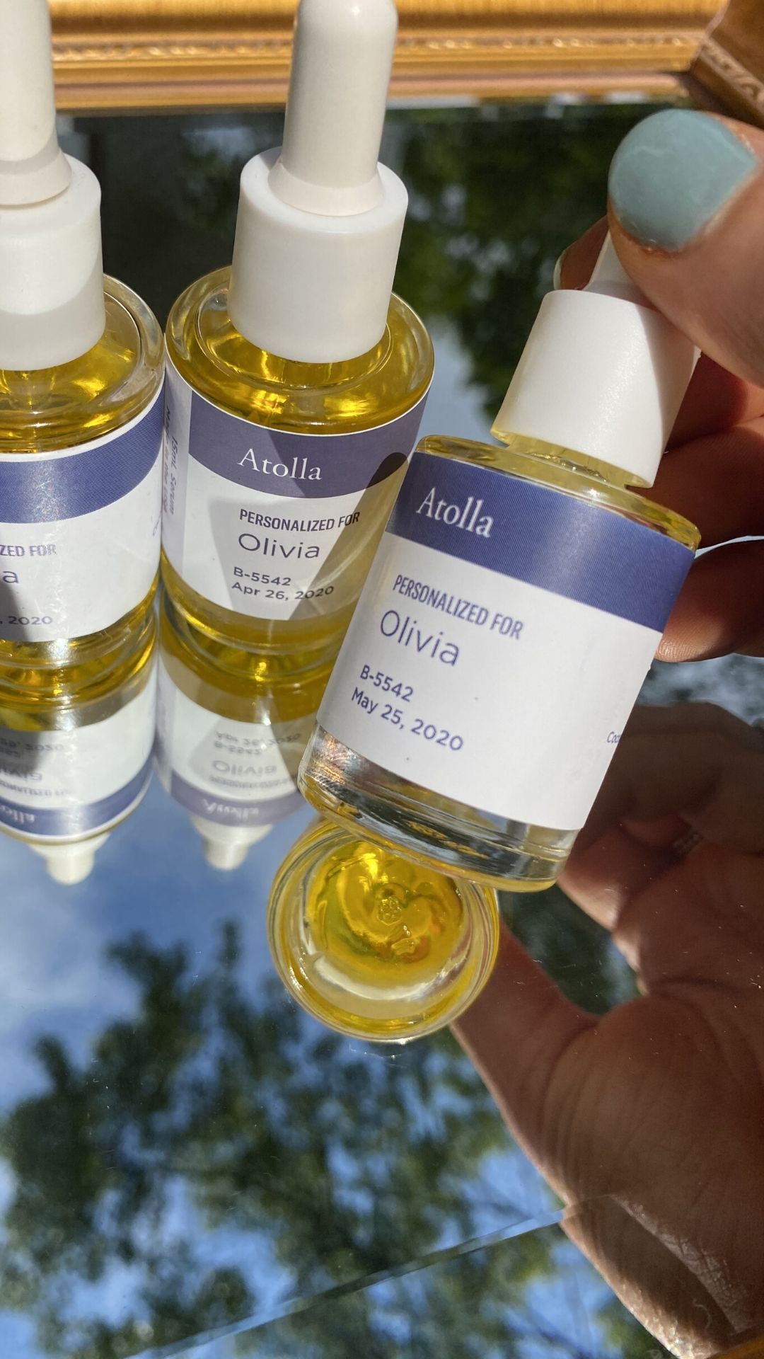 Atolla custom serums on a mirror