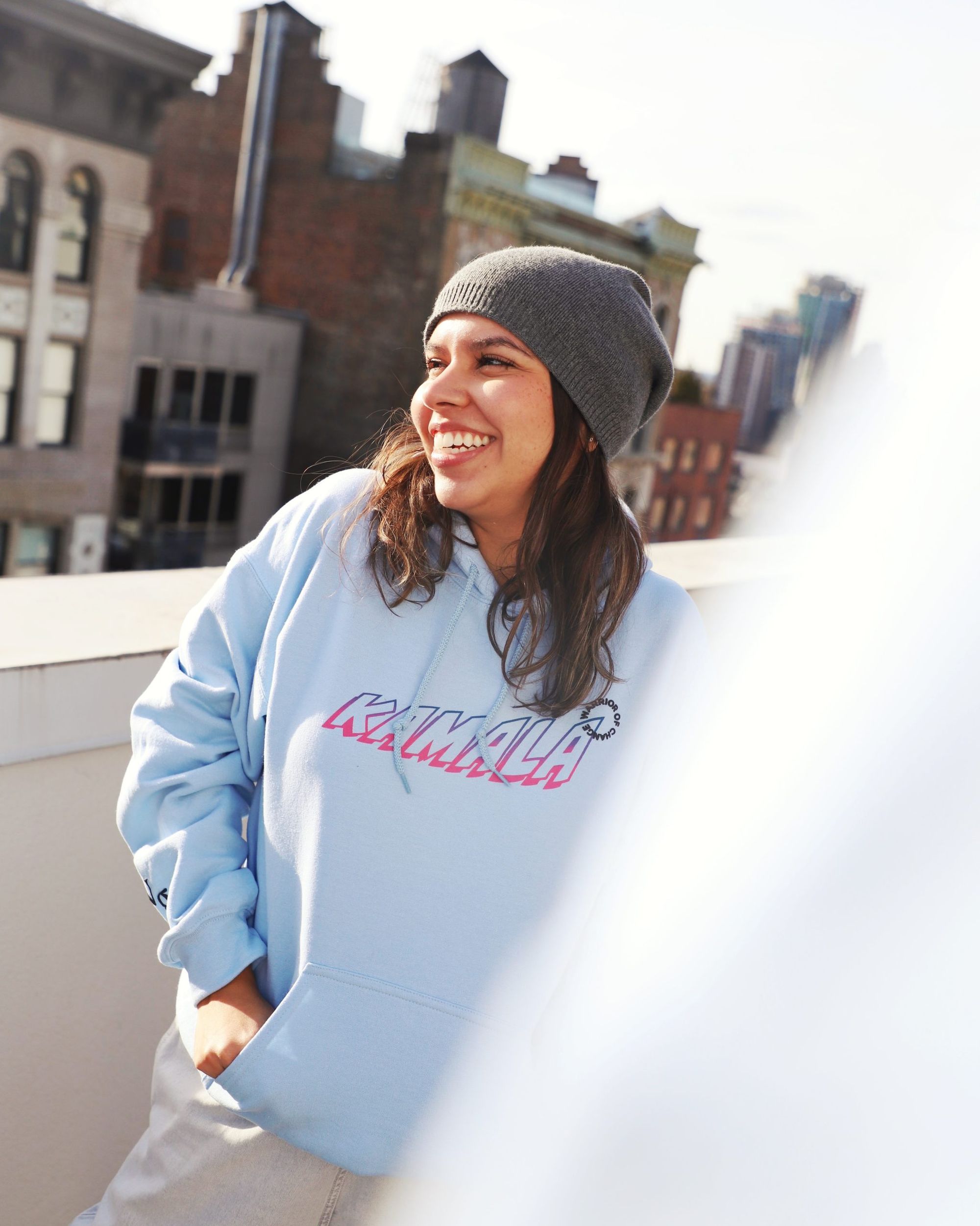 female model posing in the blue VGL kamala hoodie